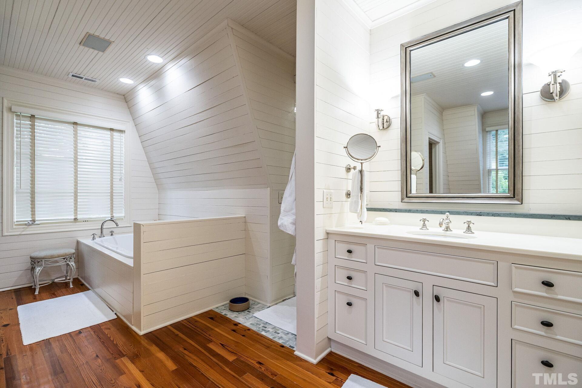 1027 Vance Street Raleigh, NC 27608 - Photo 24 of 42 a bathroom with a sink and a mirror