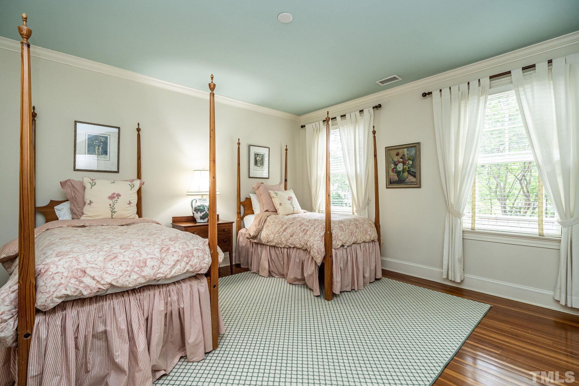 1027 Vance Street Raleigh, NC 27608 - Photo 28 of 42 a bedroom with double bed and a window