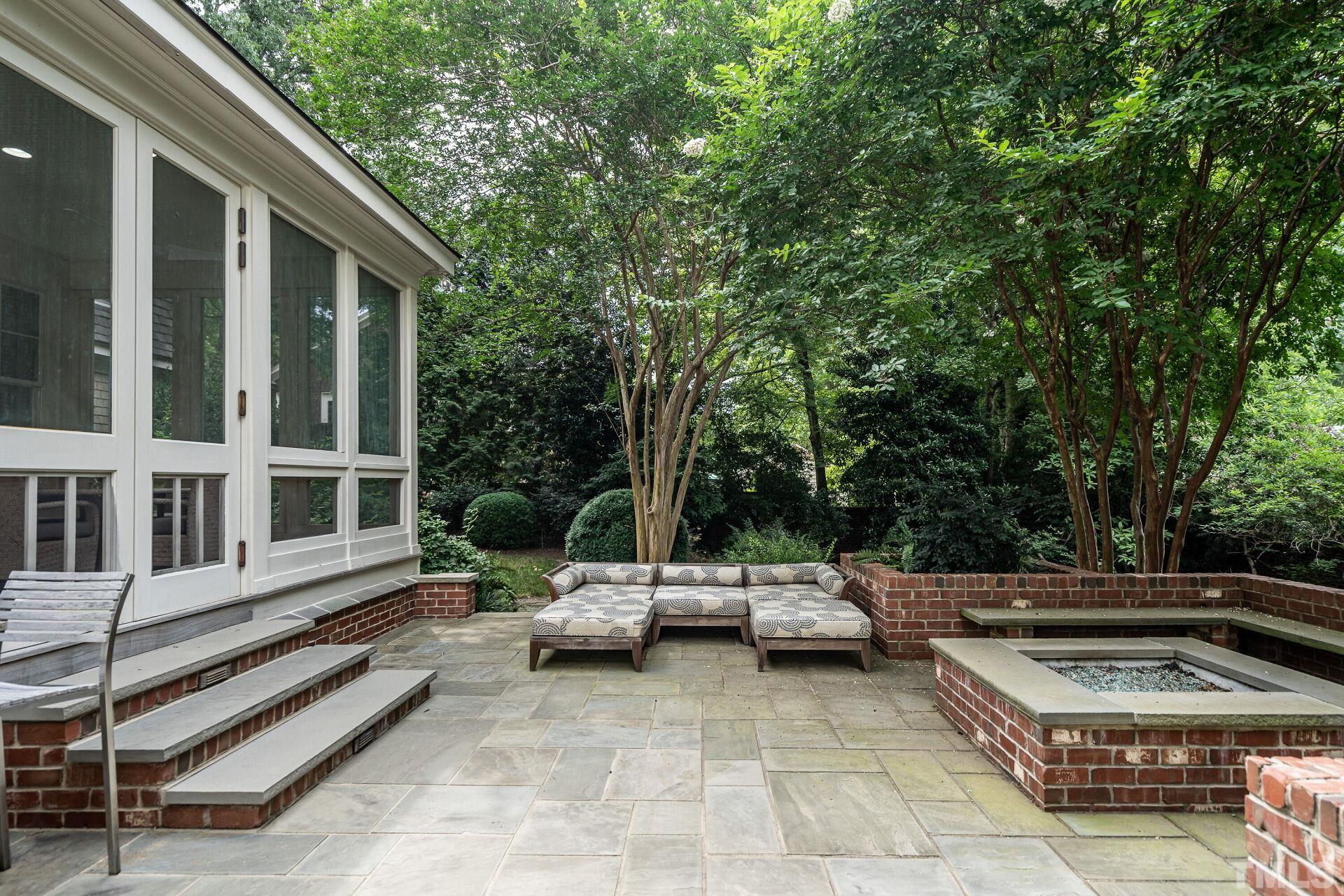 1027 Vance Street Raleigh, NC 27608 - Photo 33 of 42 a view of a patio with table and chairs with wooden floor and fence