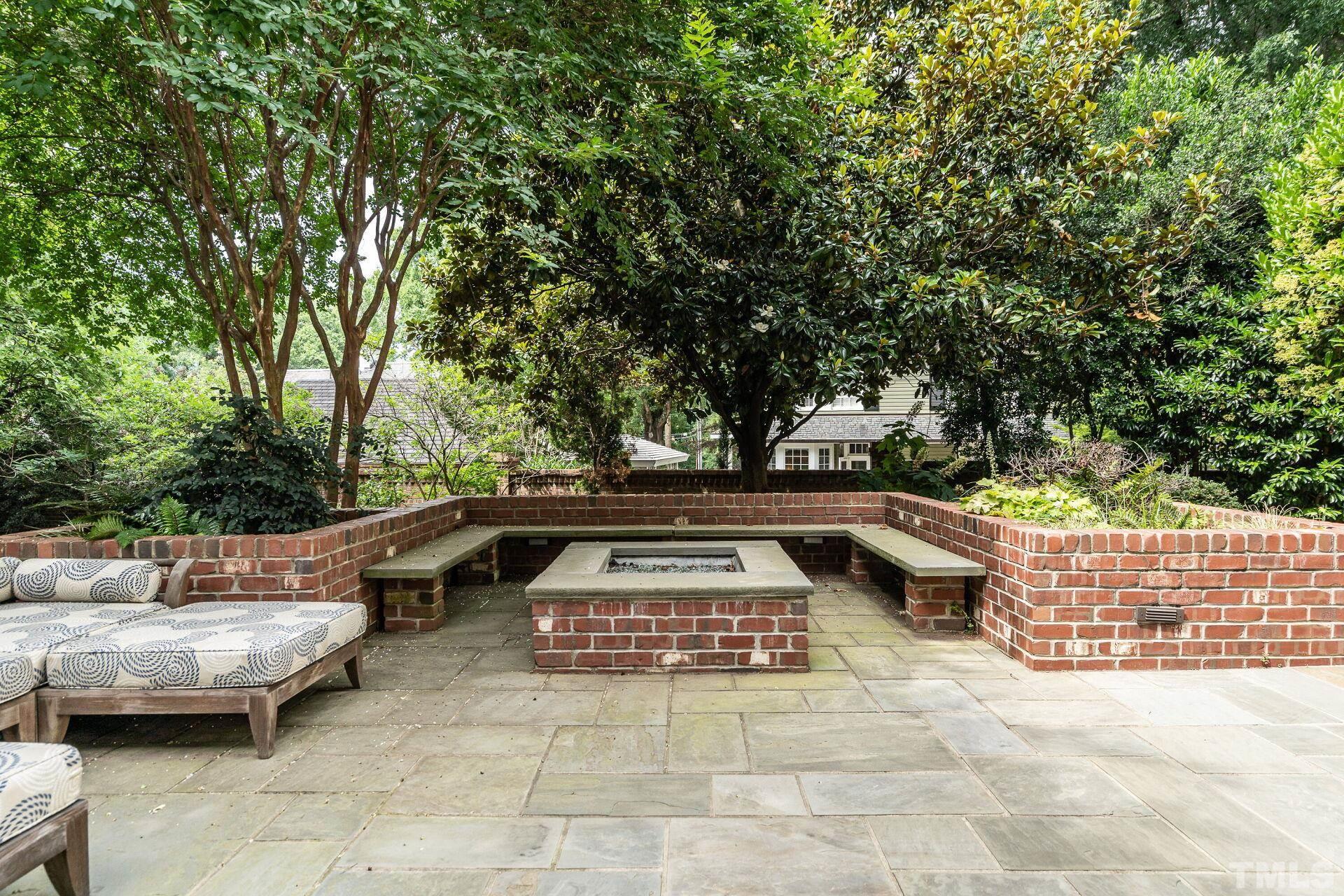 1027 Vance Street Raleigh, NC 27608 - Photo 35 of 42 a view of outdoor sitting area with furniture and trees