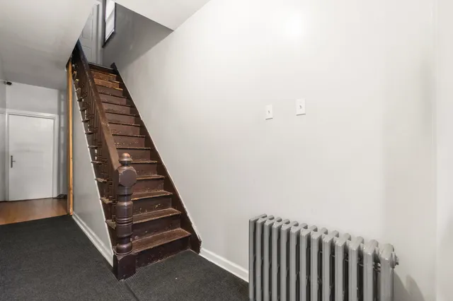 a view of a staircase with wooden floor