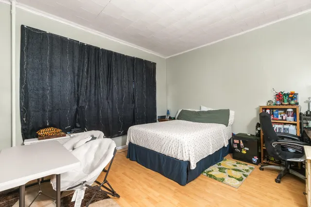 a bedroom with a bed and a table in it