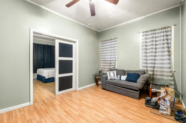 a bedroom with furniture and a window