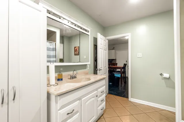 a bathroom with a sink and a mirror