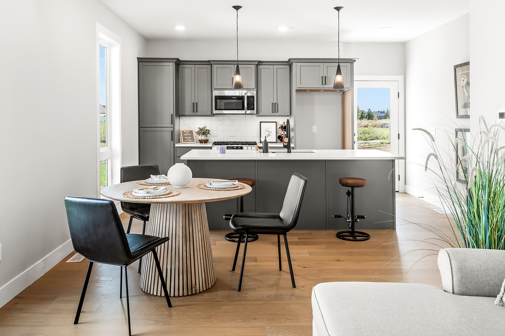 3613 Cabernet Court Normal, IL 61761 - Photo 12 of 41 a kitchen with a table chairs refrigerator and microwave