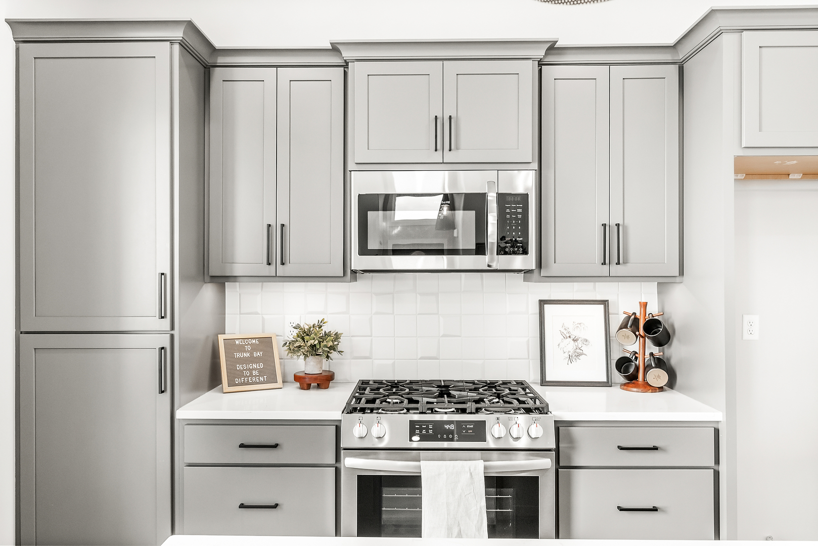3613 Cabernet Court Normal, IL 61761 - Photo 13 of 41 a kitchen with stainless steel appliances white cabinets and a stove