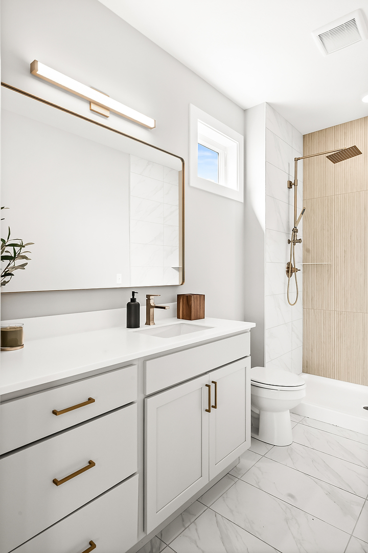 3613 Cabernet Court Normal, IL 61761 - Photo 20 of 41 a bathroom with a double vanity sink a toilet and a shower