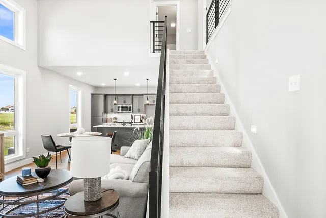 a dining room with furniture and entryway