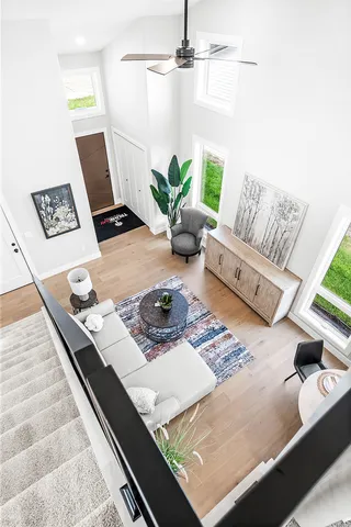 a living room with furniture and next to a window