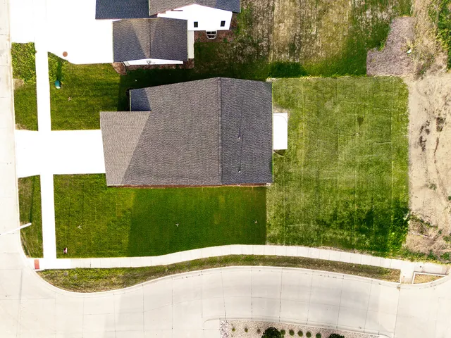 a house with swimming pool in front of it