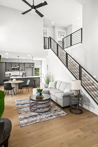 a living room with furniture and a rug