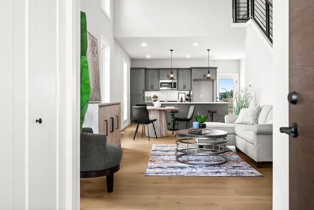 a living room with fireplace furniture and a chandelier