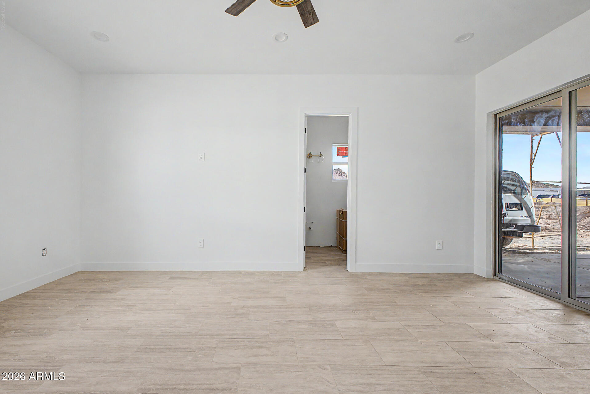 18815 West Arlington Road Buckeye, AZ 85326 - Photo 34 of 56 an empty room with closet and mirrors