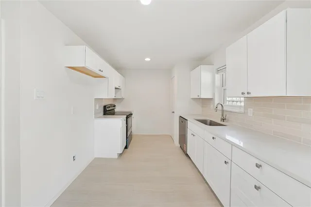 a kitchen with a stove and a microwave