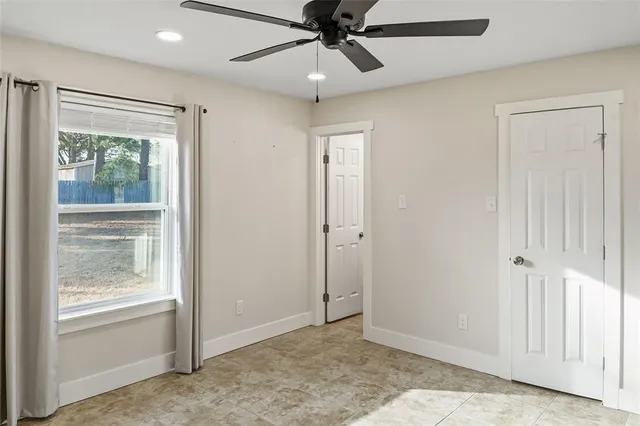 a view of an empty room and window