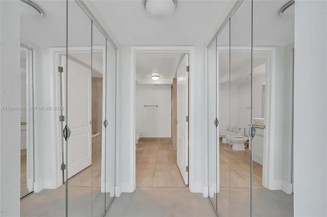 a bathroom with a shower and a glass door