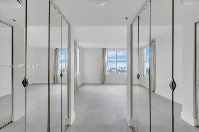 a view of a bathroom with a glass shower door