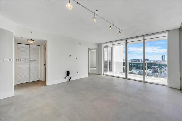a view of an empty room with a sliding door