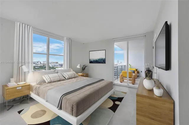 a bedroom with a bed couch and a window