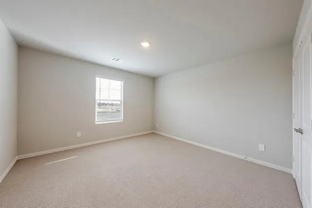 a bathroom with a double vanity sink mirror and toilet