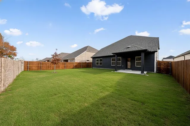 a large tree in front of a house
