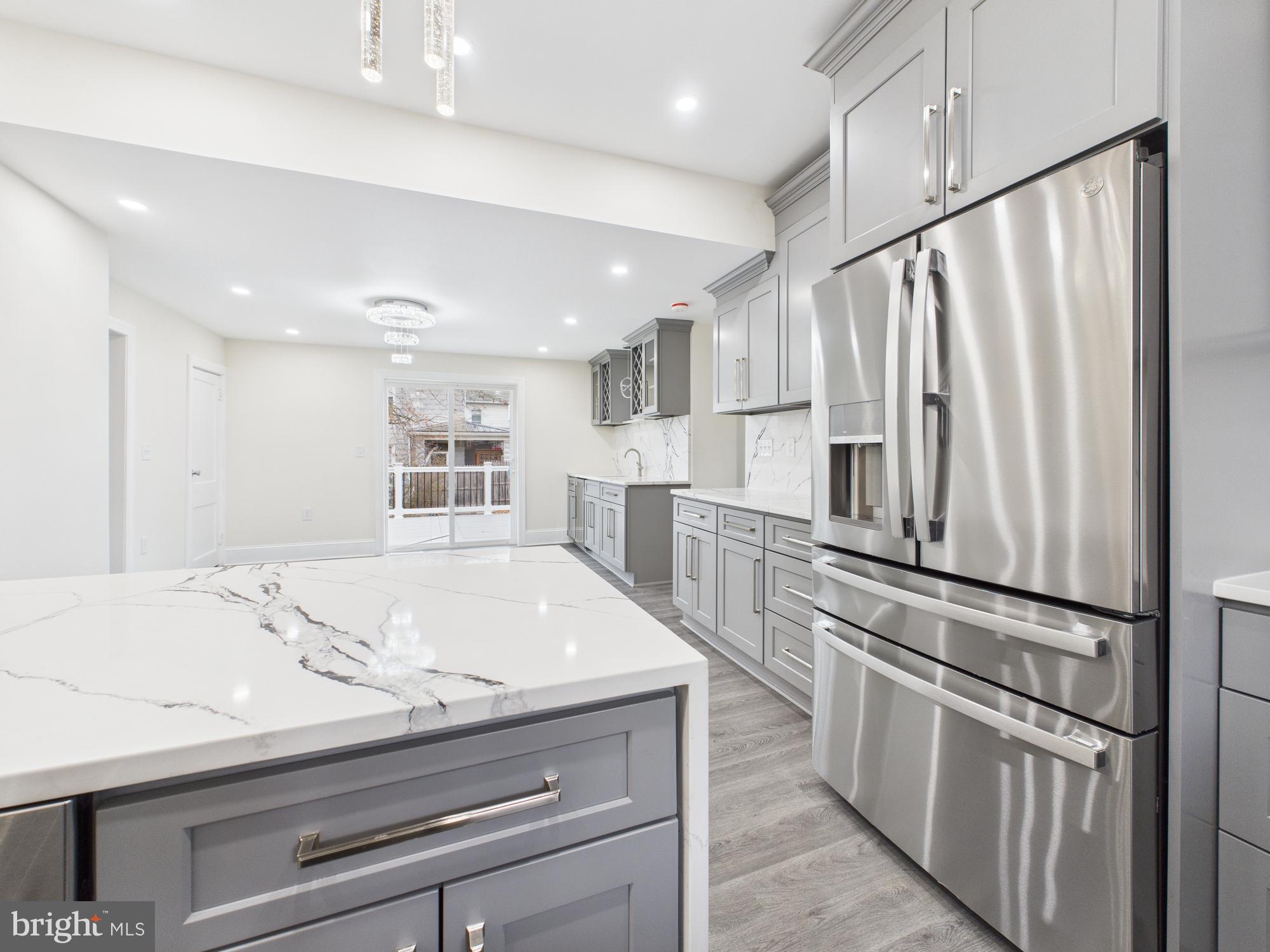 820 East Oldtown Road Cumberland, MD 21502 - Photo 11 of 40 a kitchen with kitchen island a sink appliances and cabinets