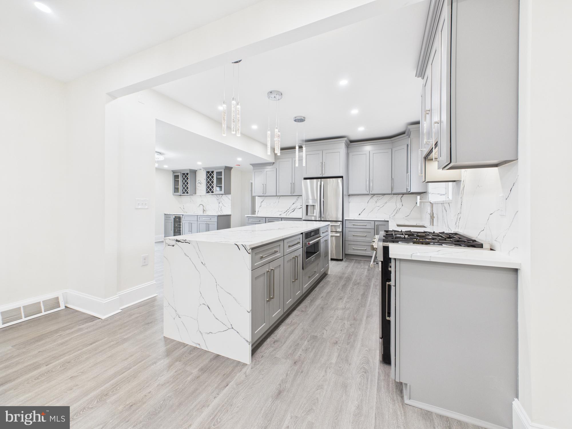 820 East Oldtown Road Cumberland, MD 21502 - Photo 12 of 40 a kitchen with white cabinets and white appliances
