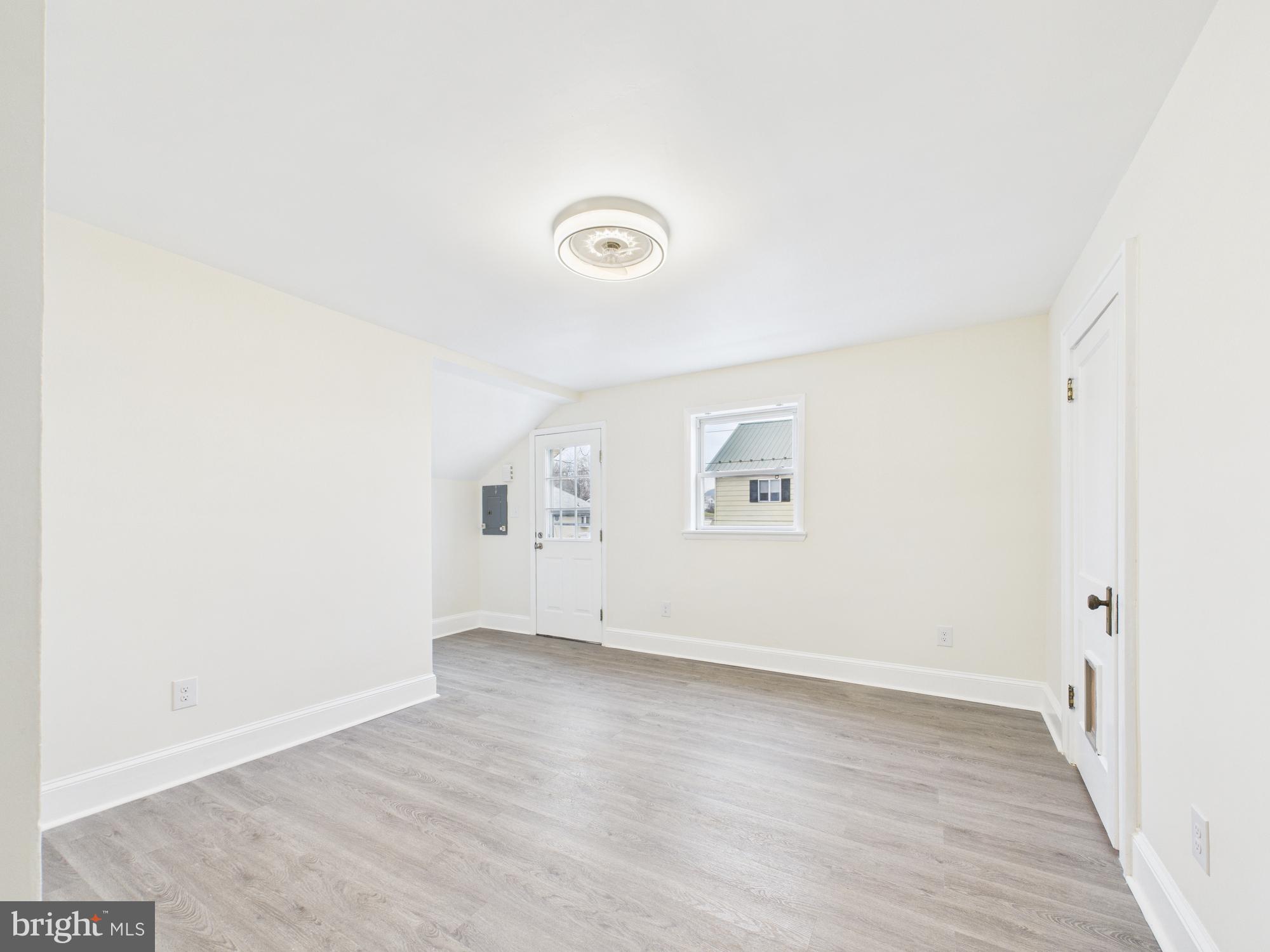 820 East Oldtown Road Cumberland, MD 21502 - Photo 20 of 40 an empty room with wooden floor and windows