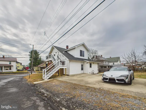 a view of a house with a street