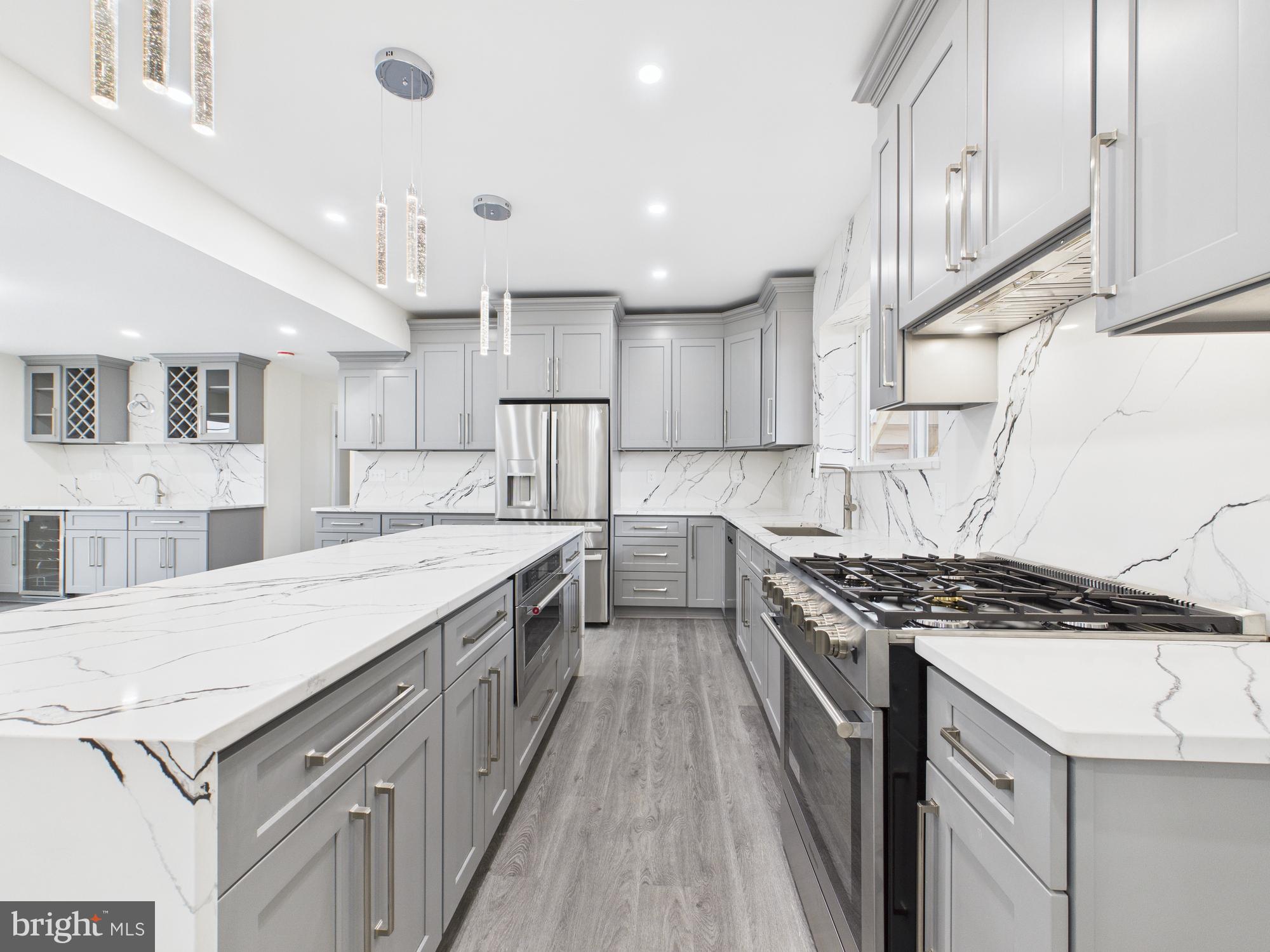 820 East Oldtown Road Cumberland, MD 21502 - Photo 3 of 40 a kitchen with granite countertop a sink stove and cabinets