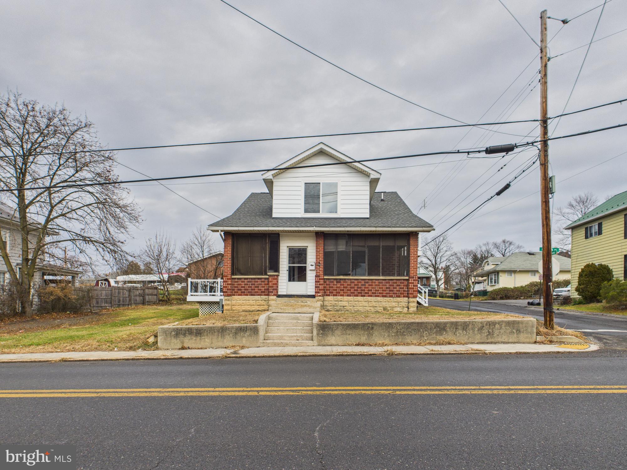 820 East Oldtown Road Cumberland, MD 21502 - Photo 32 of 40 a view of a house with a big yard and a large tree
