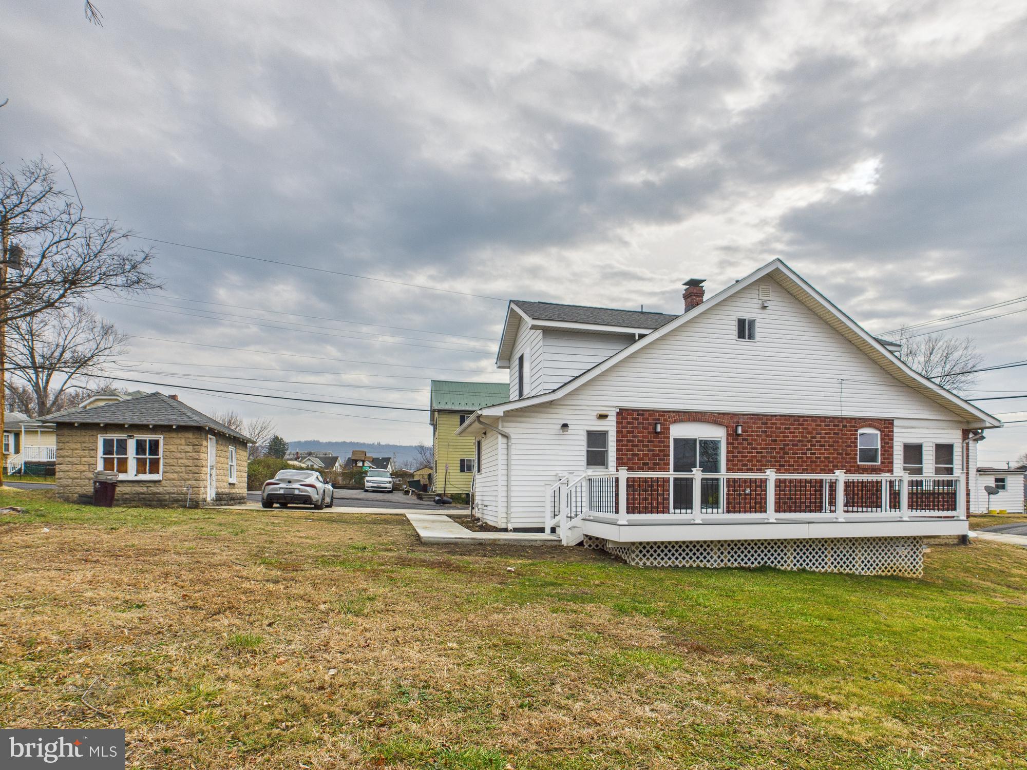 820 East Oldtown Road Cumberland, MD 21502 - Photo 35 of 40 a house view with swimming pool and trees in the background