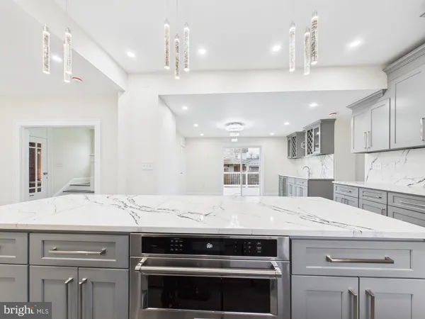 a kitchen with a stove and a sink
