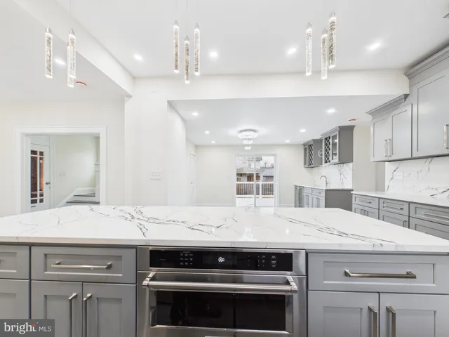 a kitchen with a stove and a sink