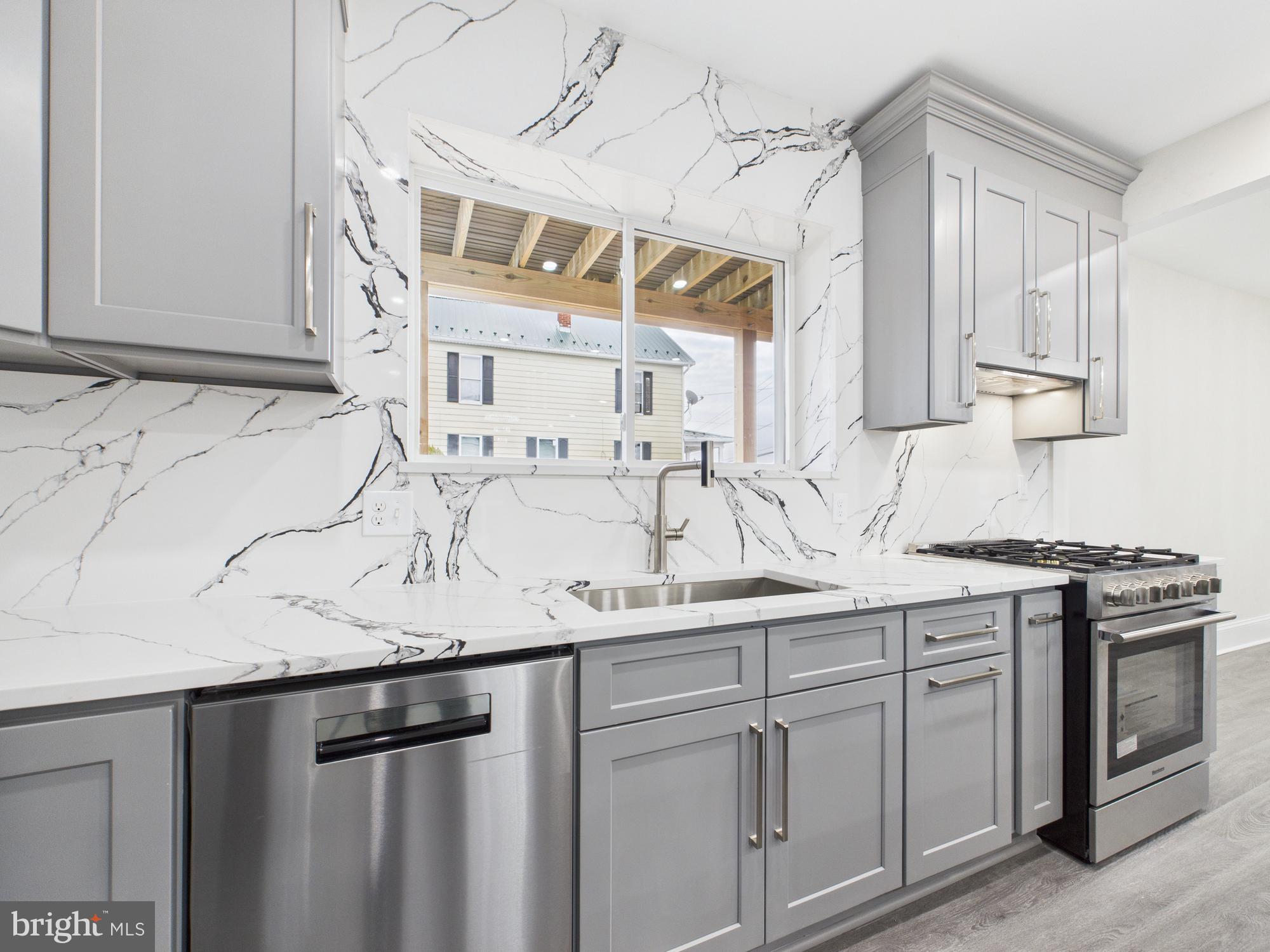 820 East Oldtown Road Cumberland, MD 21502 - Photo 9 of 40 a kitchen with stainless steel appliances granite countertop a sink and cabinets