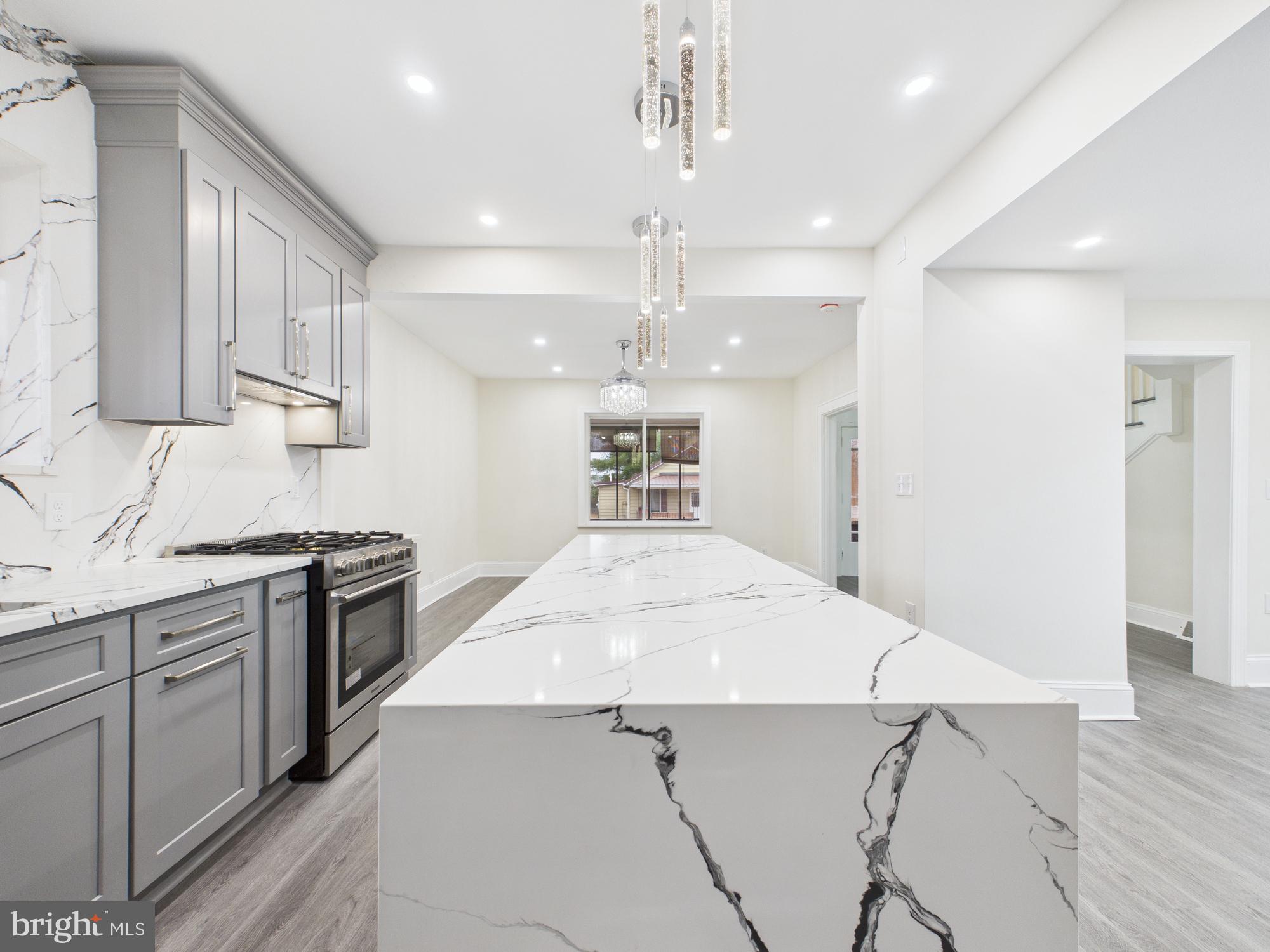 820 East Oldtown Road Cumberland, MD 21502 - Photo 10 of 40 a kitchen with a stove a refrigerator and a sink