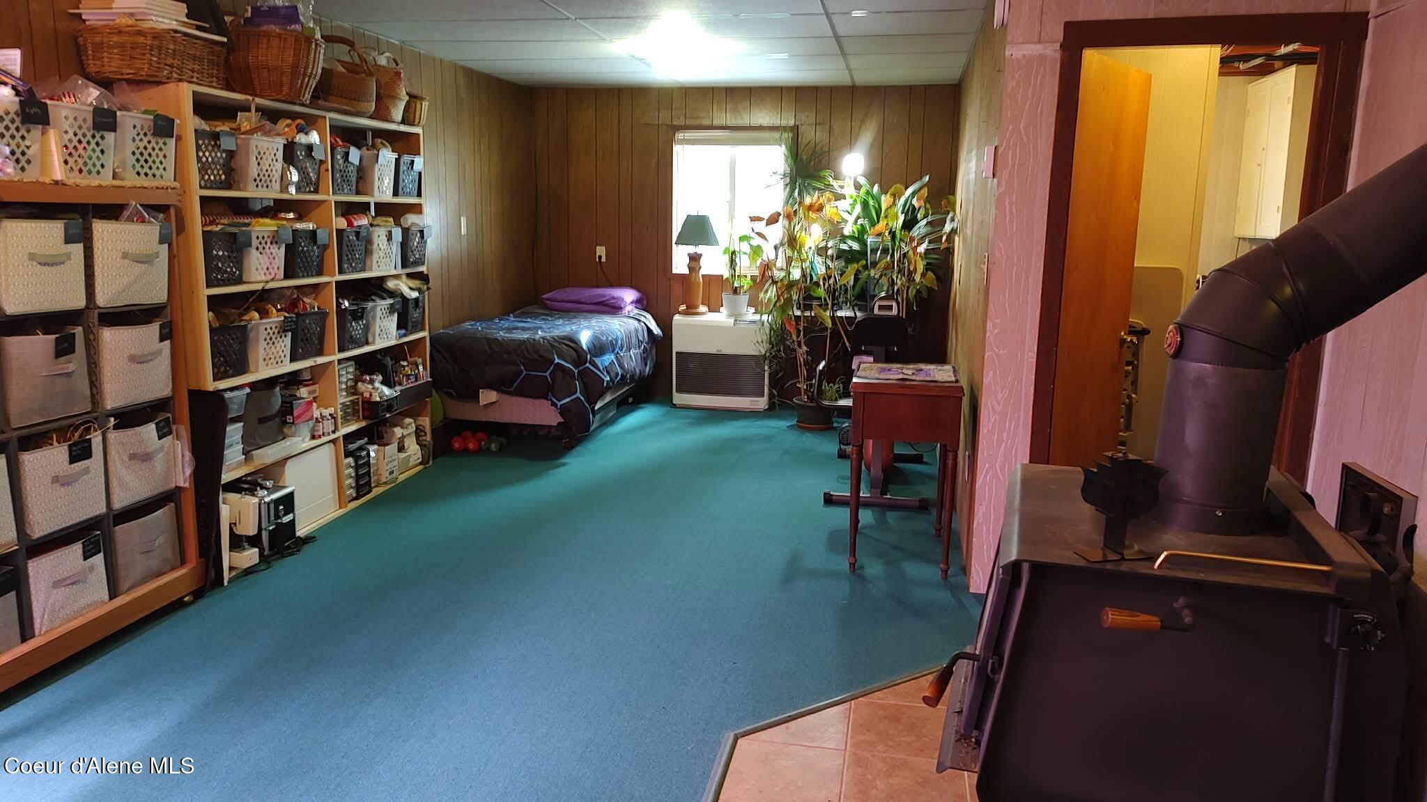 476 Clinton Avenue Coolin, ID 83821 - Photo 28 of 35 Downstairs with bed and storage