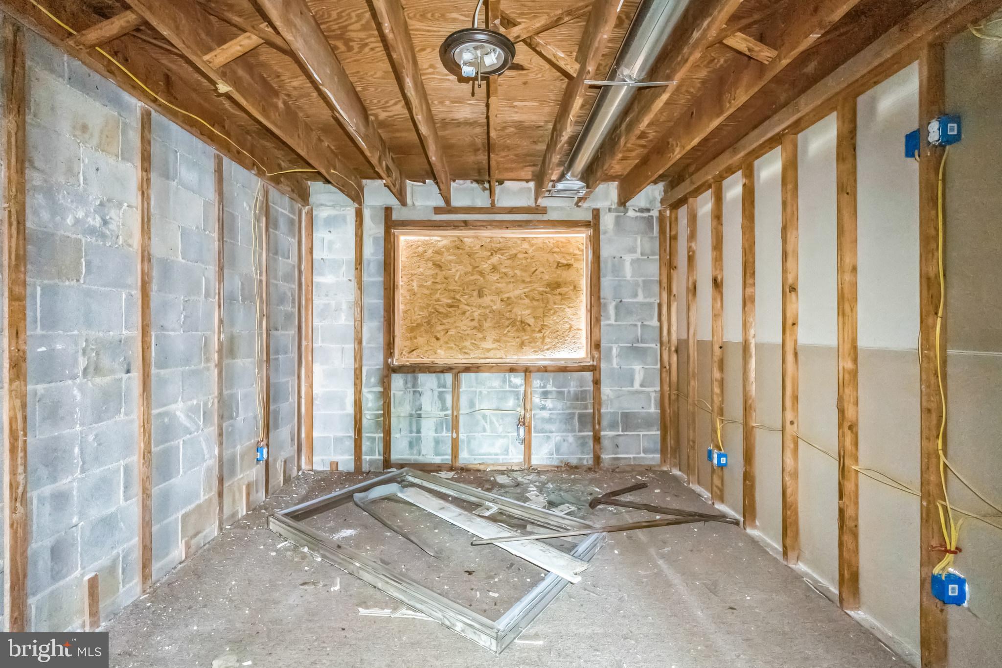 8030 Ditman Street, Unit 88P Philadelphia, PA 19136 - Photo 22 of 30 a view of a bedroom with a bed and a window