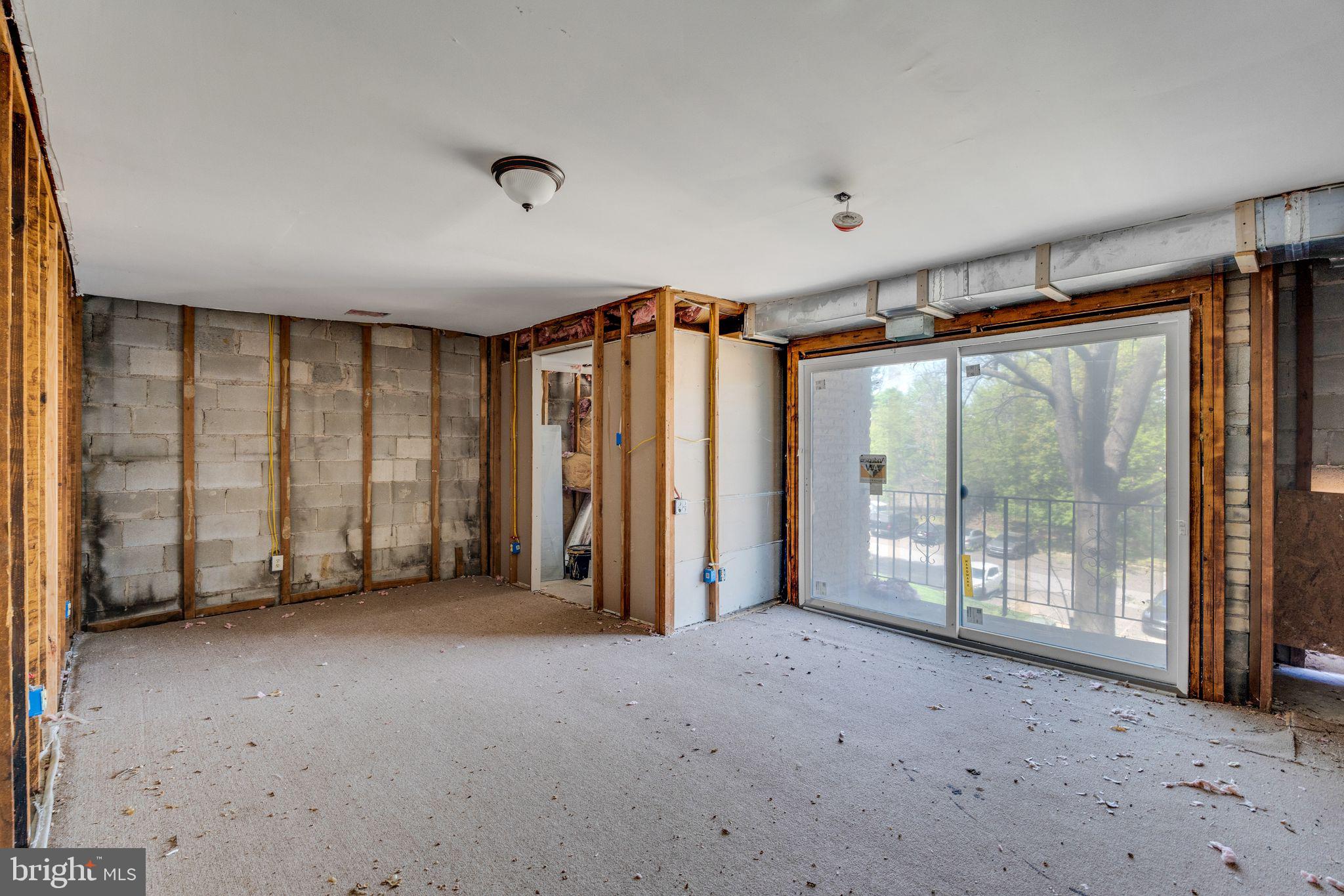 8030 Ditman Street, Unit 88P Philadelphia, PA 19136 - Photo 6 of 30 a view of an empty room with a sliding door