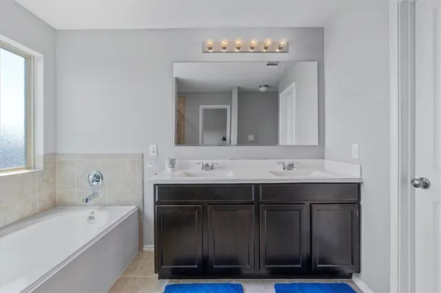 a bathroom with a sink and a bathtub