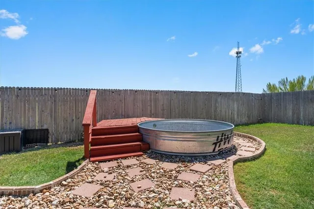 a backyard of a house with a garden