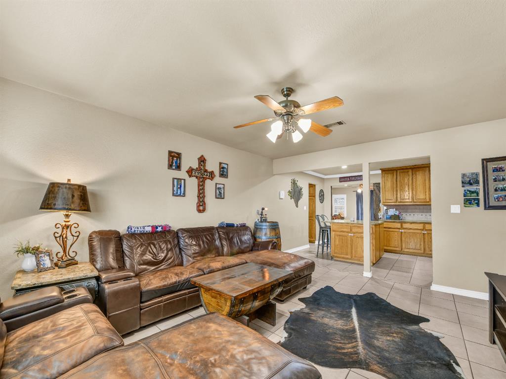 325 Huggins Drive Springtown, TX 76082 - Photo 2 of 28 a living room with furniture and wooden floor