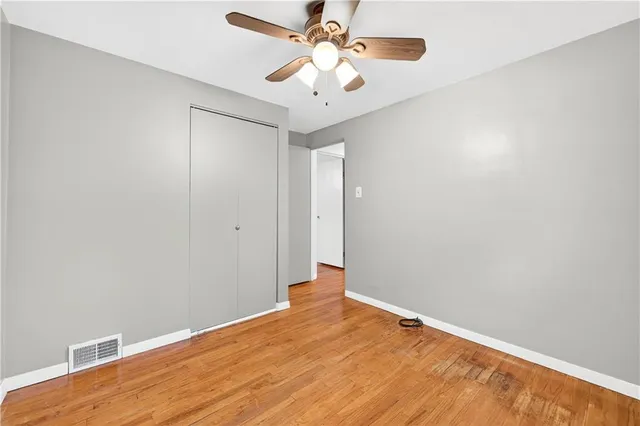 a bedroom with a bed and cabinets