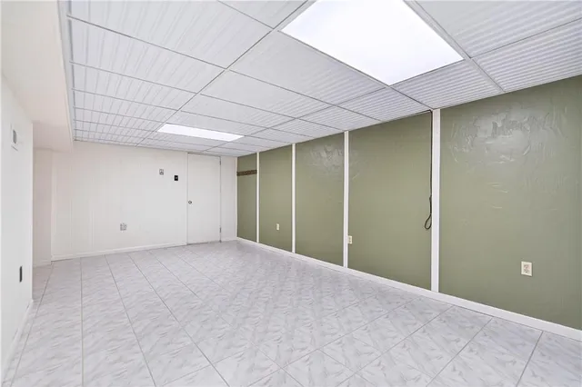 a bathroom with a sink mirror and toilet