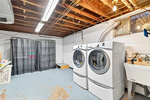 a view of a room with wooden floor and a large window