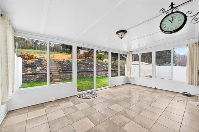 a view of empty room with windows