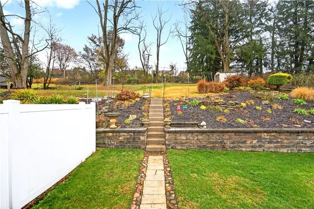a view of a backyard with swimming pool