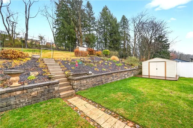 a view of yard with swimming pool