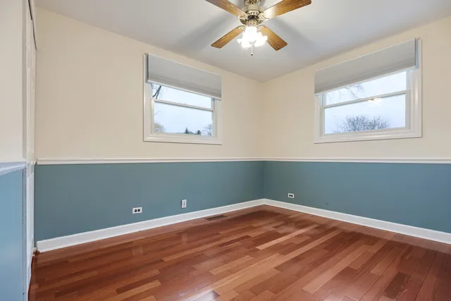 a view of room with wooden floor