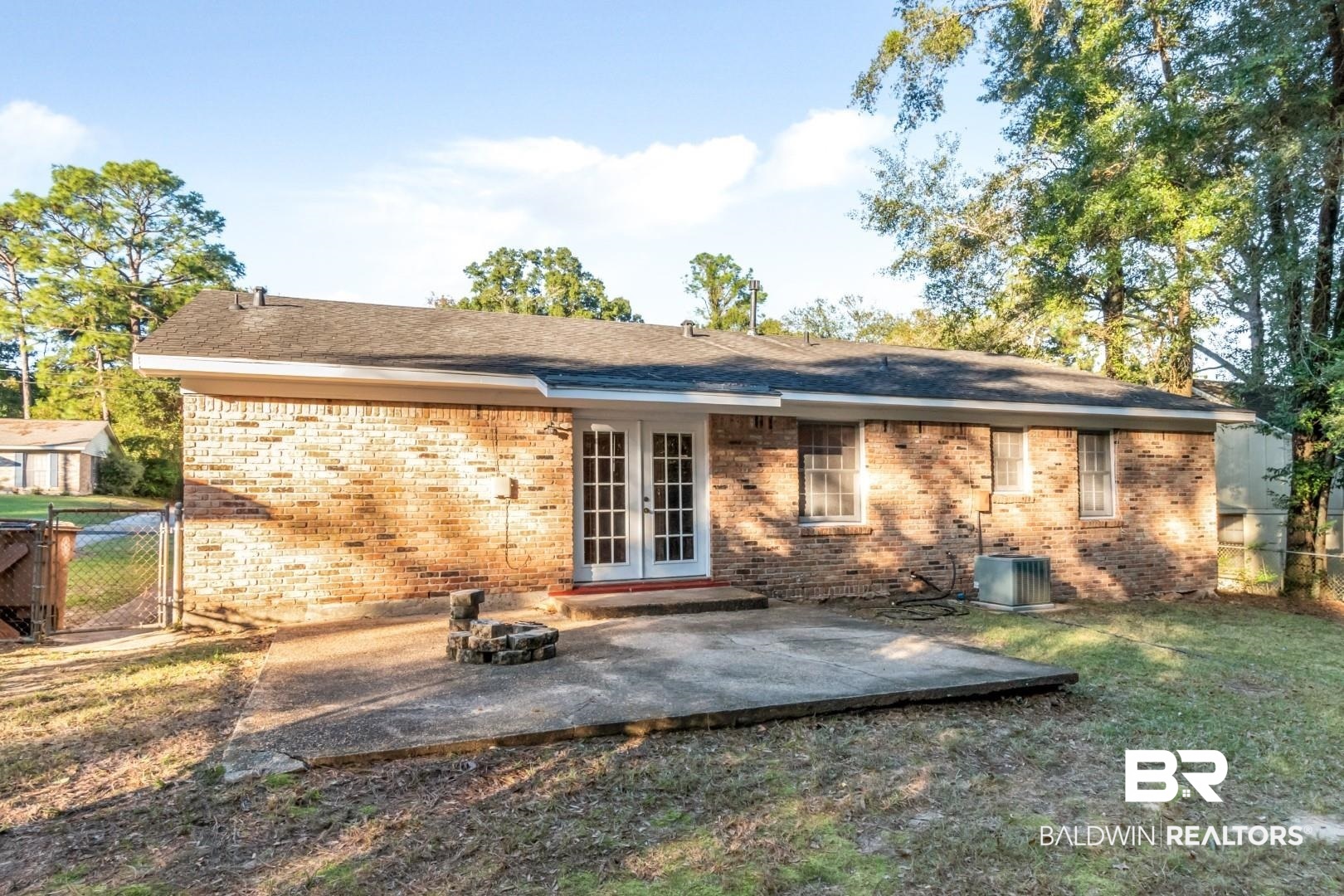5517 Vanderbilt Drive Mobile, AL 36608 - Photo 31 of 33 Rear view of property with central air condition unit, french doors, a patio, and a lawn